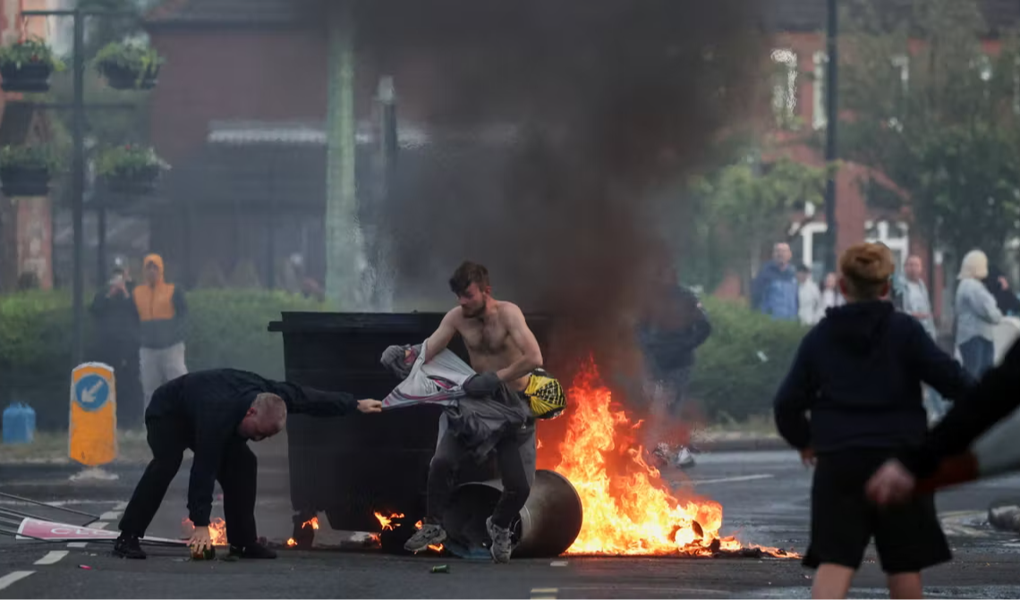 UK leaders urge calm after Belfast stabbing sparks anti-immigration protests across cities
